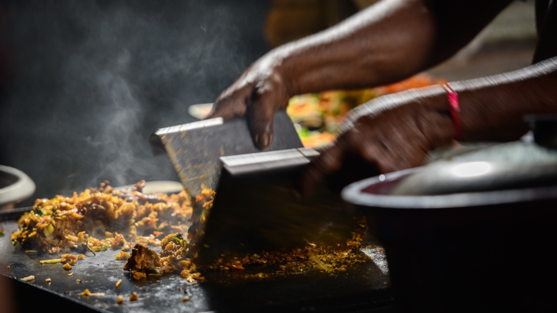 Kottu Roti being prepared on a hot griddle in Sri Lanka